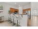 Kitchen features wood cabinets, breakfast bar with seating, and stainless steel appliances at 7612 S 36Th Ave, Tampa, FL 33619