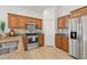 This kitchen has stainless steel appliances and beautiful wood cabinetry at 7612 S 36Th Ave, Tampa, FL 33619