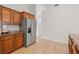 A kitchen featuring wood cabinets, granite counters, and stainless steel refrigerator at 7612 S 36Th Ave, Tampa, FL 33619