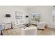 Bright living room with a large window, white sofa, modern furniture and wood laminate flooring at 7612 S 36Th Ave, Tampa, FL 33619