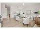 Bright and spacious living room featuring lots of natural light, and wood laminate flooring at 7612 S 36Th Ave, Tampa, FL 33619