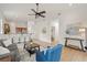 Open-concept living space featuring modern décor, connecting living spaces, and wood flooring at 7612 S 36Th Ave, Tampa, FL 33619