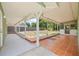 Patio features covered area, screened enclosure, and views of the green yard at 7612 S 36Th Ave, Tampa, FL 33619