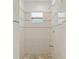 Clean shower with tiled walls, mosaic accents, and a built-in showerhead at 7612 S 36Th Ave, Tampa, FL 33619