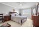 Comfortable bedroom with neutral walls, tile floors, and a large window at 7701 Starkey Rd # 332, Seminole, FL 33777