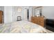 Cozy bedroom featuring neutral paint, a bed with a patterned comforter, and a dresser at 7701 Starkey Rd # 332, Seminole, FL 33777