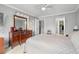 Spacious bedroom with tile floors, a large dresser, and a walk-in closet at 7701 Starkey Rd # 332, Seminole, FL 33777