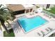 Aerial view of the community pool with surrounding lounge chairs and well maintained grounds at 7701 Starkey Rd # 332, Seminole, FL 33777