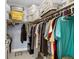 Walk-in closet featuring neutral walls, tile floors, and ample storage at 7701 Starkey Rd # 332, Seminole, FL 33777