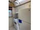 Compact kitchen featuring white appliances, gas range, and upper cabinets at 7941 58Th N Ave # 106, St Petersburg, FL 33709