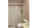 Bathroom featuring a tiled shower with safety bar and shower wand, and a standard toilet at 7941 58Th N Ave # 106, St Petersburg, FL 33709