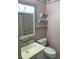Standard bathroom featuring a vanity, toilet, and shower with a unique vintage design at 7941 58Th N Ave # 106, St Petersburg, FL 33709