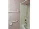 Standard shower head and white tiled backsplash with shower safety bar at 7951 58Th N Ave # 106, St Petersburg, FL 33709