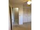 Bedroom with an open doorway and closet, perfect for adding personal touches at 7951 58Th N Ave # 106, St Petersburg, FL 33709