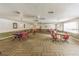 Carpeted card room featuring several tables and chairs plus natural lighting at 7951 58Th N Ave # 106, St Petersburg, FL 33709