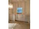 Dining room with built-in cabinets and a pass-through to the kitchen at 7951 58Th N Ave # 106, St Petersburg, FL 33709