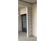 Exterior entryway to home with a decorative concrete block column and a brick wall at 7941 58Th N Ave # 106, St Petersburg, FL 33709