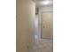 Hallway showcasing tile flooring, a closet, and access to other rooms at 7941 58Th N Ave # 106, St Petersburg, FL 33709