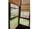 Enclosed patio with screened windows overlooking the lake, offering tranquil views and fresh air at 7941 58Th N Ave # 106, St Petersburg, FL 33709