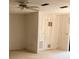A living room featuring neutral walls and a ceiling fan at 7941 58Th N Ave # 106, St Petersburg, FL 33709