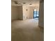 Spacious living room with a view towards the lanai at 7941 58Th N Ave # 106, St Petersburg, FL 33709