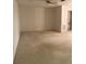 Spacious living room featuring ample space and a view of the hallway, perfect for relaxation and gatherings at 7941 58Th N Ave # 106, St Petersburg, FL 33709