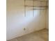 Empty carpeted room with built in shelving offering great storage potential at 7941 58Th N Ave # 106, St Petersburg, FL 33709