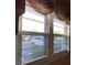 View from the window showcasing the parking area and surrounding greenery at 7941 58Th N Ave # 106, St Petersburg, FL 33709