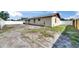 A fenced backyard is shown with ample space to landscape or entertain at 811 Pebblewood Dr, Brandon, FL 33511