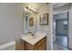 Bathroom featuring wood vanity, sink, toilet, and mirror with lighting at 811 Pebblewood Dr, Brandon, FL 33511