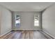 Bedroom with two windows and wood flooring at 811 Pebblewood Dr, Brandon, FL 33511