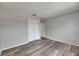 A bright bedroom showcases wood-look floors, fresh light-grey paint, and a closet at 811 Pebblewood Dr, Brandon, FL 33511