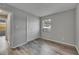 Comfortable bedroom with a double closet, AC, and modern wood-look flooring at 811 Pebblewood Dr, Brandon, FL 33511