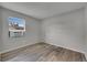 Bedroom with air conditioning, window, wood-look flooring and neutral wall color at 811 Pebblewood Dr, Brandon, FL 33511