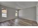 Bedroom with three windows and modern wood flooring at 811 Pebblewood Dr, Brandon, FL 33511