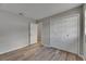 Bedroom features a closet, wood-look flooring, and neutral gray walls at 811 Pebblewood Dr, Brandon, FL 33511