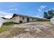 A view of the back exterior, fenced yard, and patio area at 811 Pebblewood Dr, Brandon, FL 33511