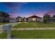 Lovely single-Gathering home at twilight with a well-maintained lawn and classic mailbox at 811 Pebblewood Dr, Brandon, FL 33511