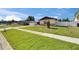 Inviting home with well-kept front yard, sidewalk, and lush greenery in a peaceful setting at 811 Pebblewood Dr, Brandon, FL 33511