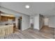 Open floor plan with stainless steel appliances and wood-look flooring at 811 Pebblewood Dr, Brandon, FL 33511