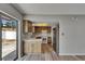Kitchen showcasing a stainless steel refrigerator and a sliding glass door to the backyard at 811 Pebblewood Dr, Brandon, FL 33511