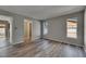 Spacious living room with view to kitchen and wood flooring at 811 Pebblewood Dr, Brandon, FL 33511