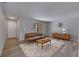 Bright living room featuring neutral walls, hardwood floors, and a modern sofa and coffee table at 811 Pebblewood Dr, Brandon, FL 33511