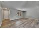 Large living room showcasing wood flooring and a view to the outdoors through a window at 811 Pebblewood Dr, Brandon, FL 33511