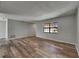 Bright living room with continuous flooring and a large window, offering a comfortable space at 811 Pebblewood Dr, Brandon, FL 33511