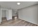 Bright living room showcasing wood-look flooring and neutral gray walls at 811 Pebblewood Dr, Brandon, FL 33511