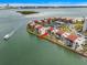 Waterfront condominiums with red tile roofs are nestled along the tranquil bay, offering scenic views and convenient parking at 868 Bayway Blvd # 206, Clearwater Beach, FL 33767