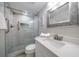 Modern bathroom with glass-enclosed shower, updated vanity, and decorative tiling at 868 Bayway Blvd # 206, Clearwater Beach, FL 33767