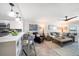 Open floor plan with modern furniture, bar seating, and soothing decor providing a comfortable and stylish living space at 868 Bayway Blvd # 206, Clearwater Beach, FL 33767
