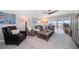 Inviting living room features modern furnishings, ceiling fan and expansive water views at 868 Bayway Blvd # 206, Clearwater Beach, FL 33767